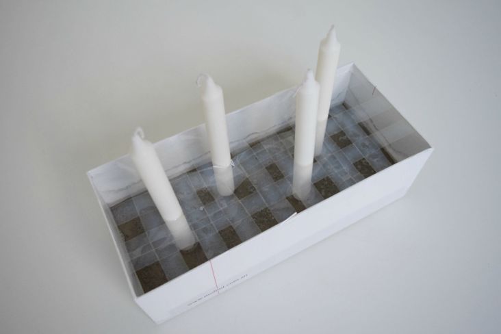 Allow concrete to set with candle in place
