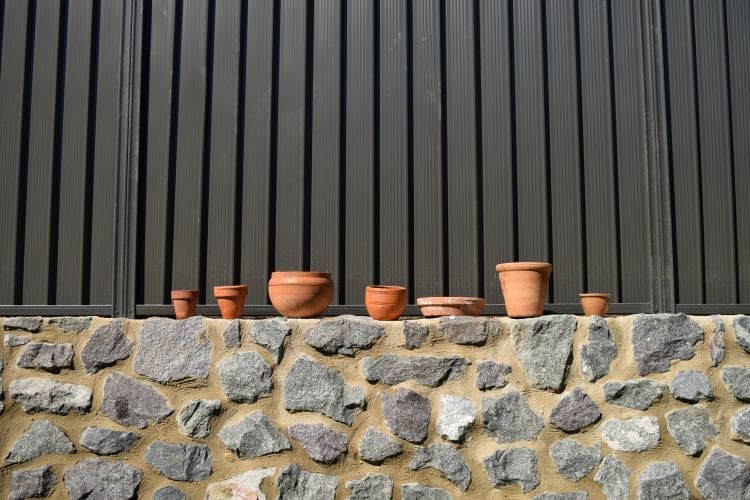 Drab looking pot plants before being painted