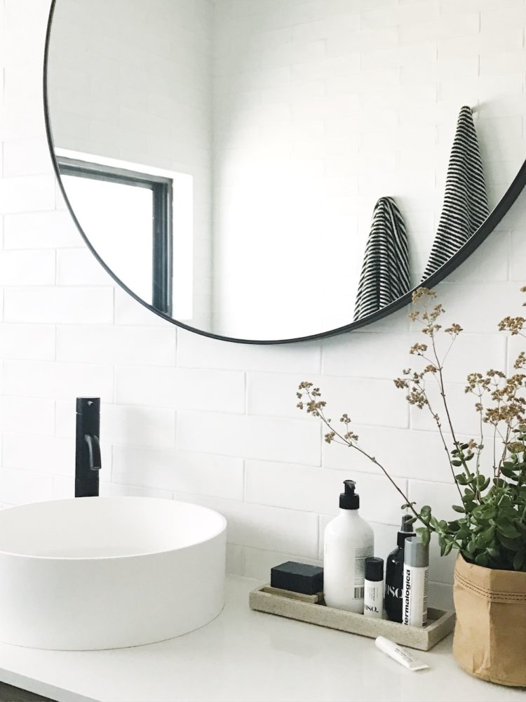 Bathroom vanity with round mirror