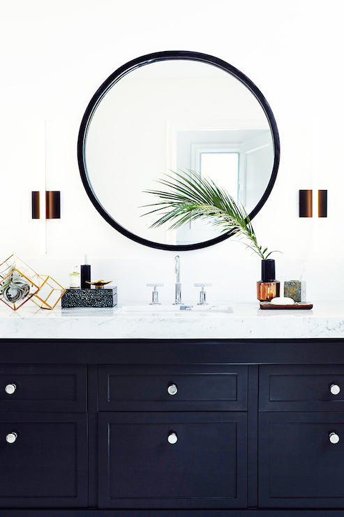 Black round mirrors and black bathroom vanity