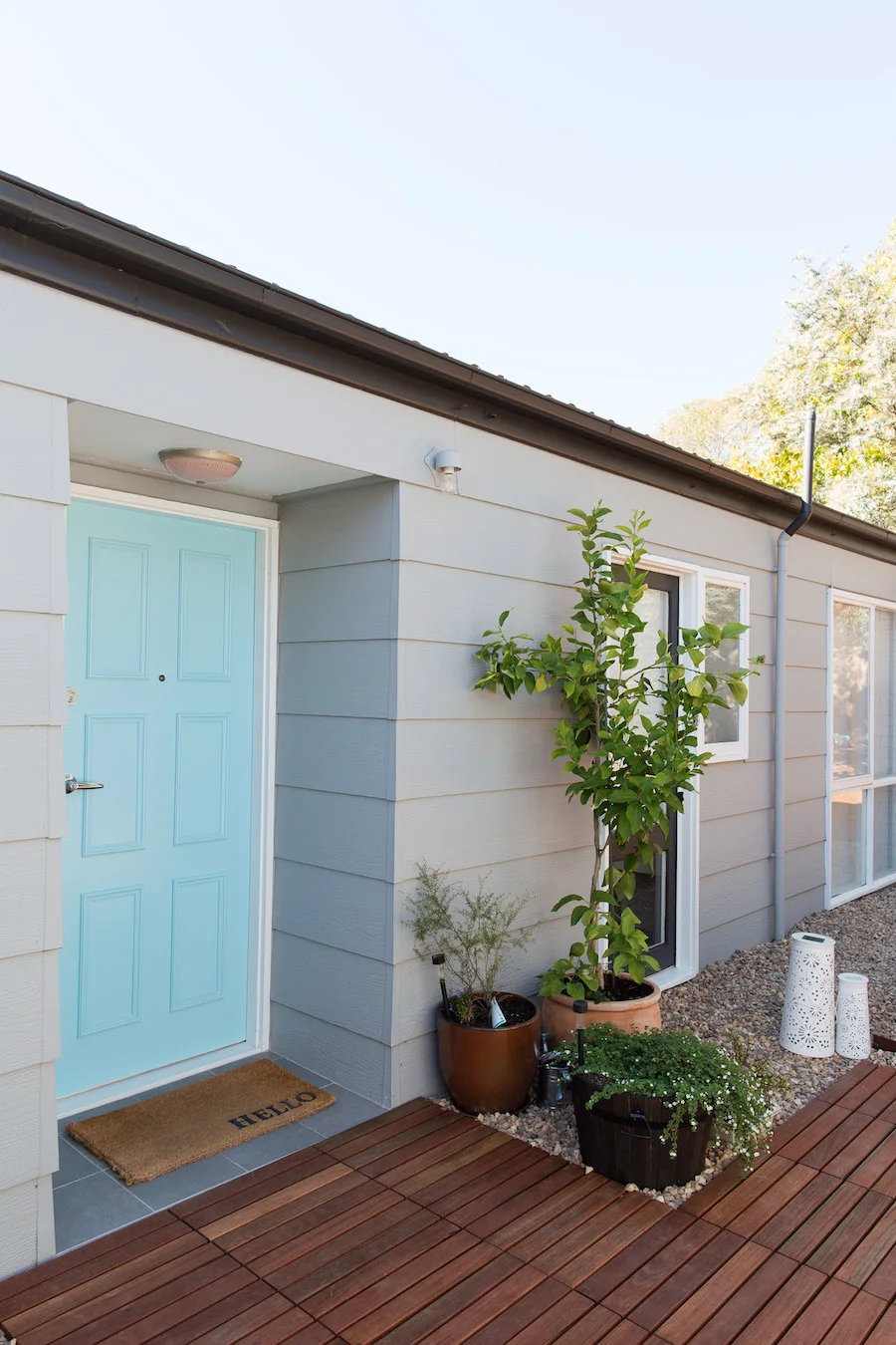 Light blue front door in weatherboard full house renovation