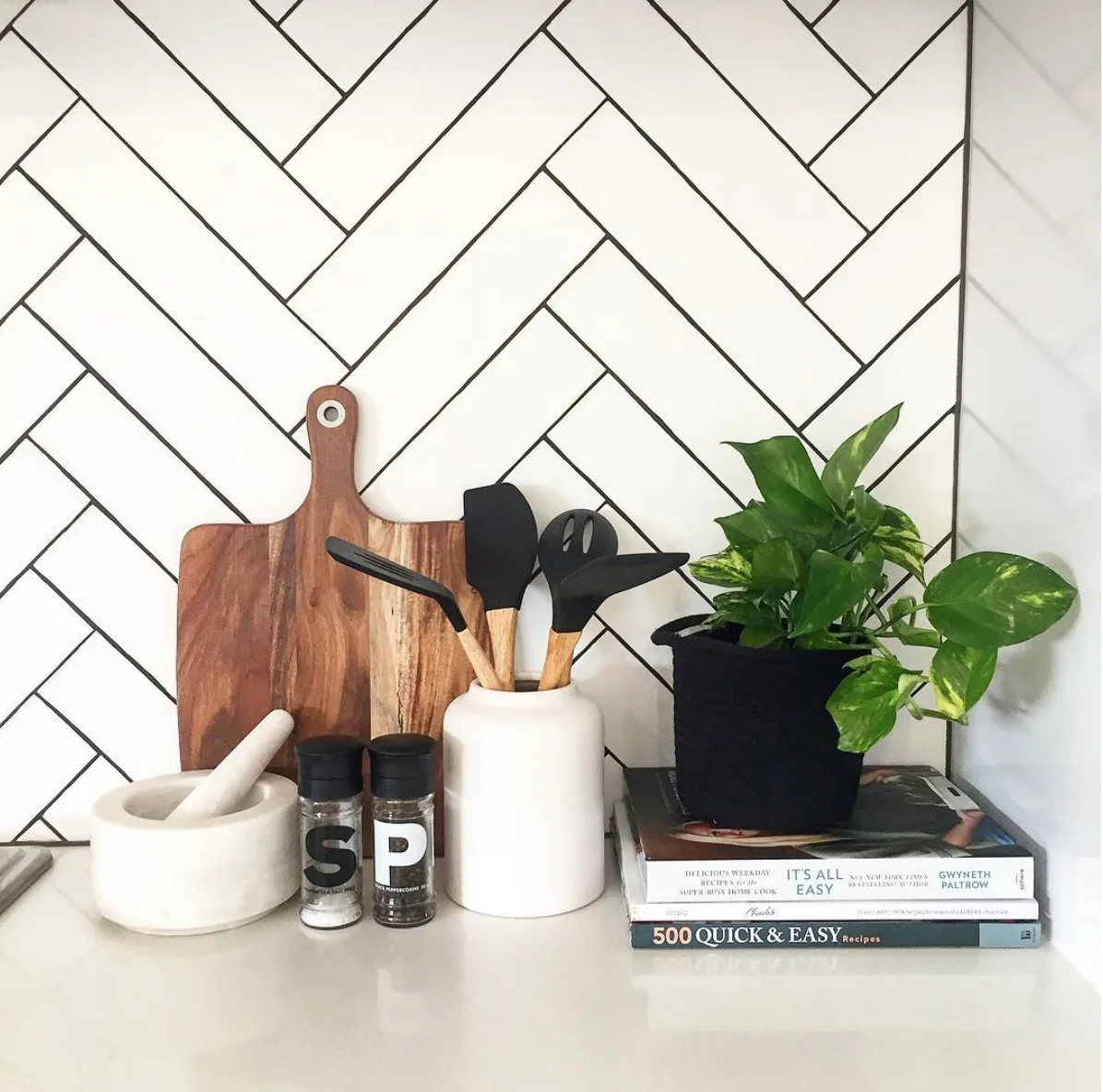 Kitchen vignette with white herringbone tile