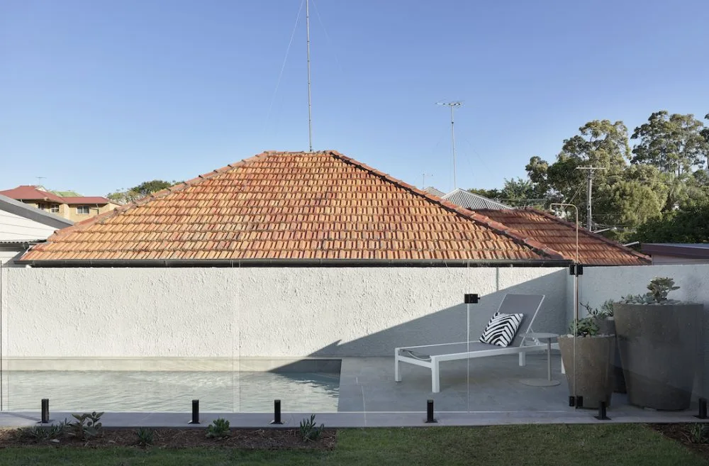 Outdoor pool with frameless glass fence