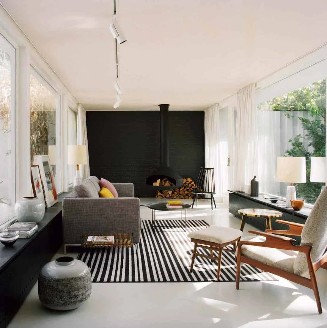 Black painted brick feature wall in living room