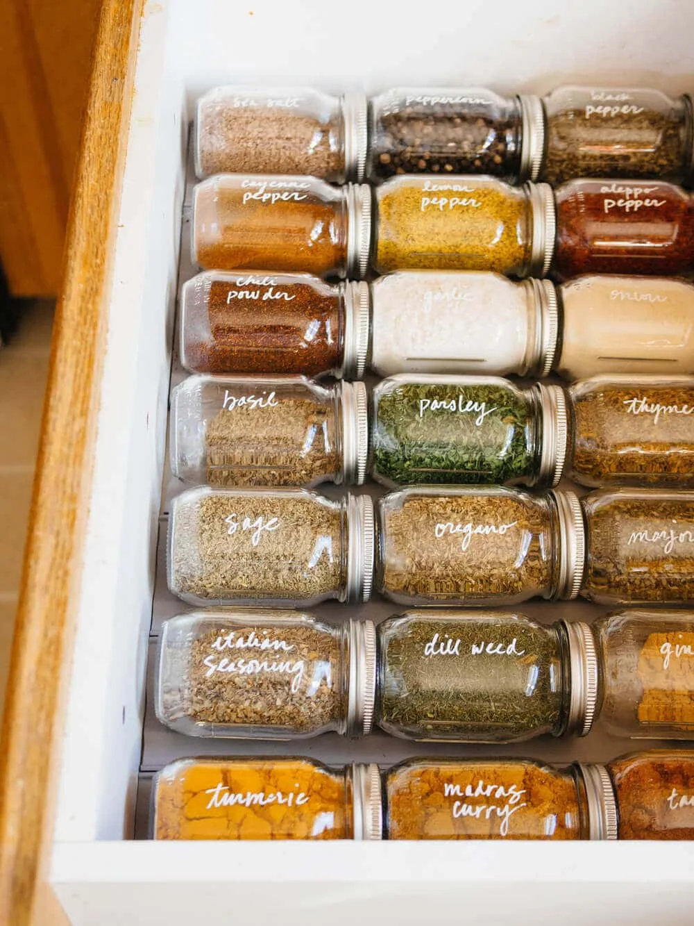 Spice drawer using grooves