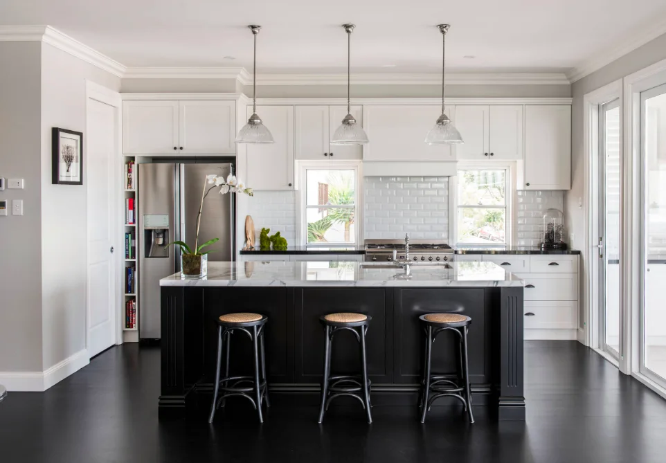 Hamptons kitchen with black floors