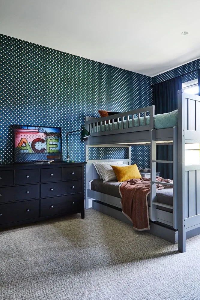 Graphic navy blue wallpaper in boy's room