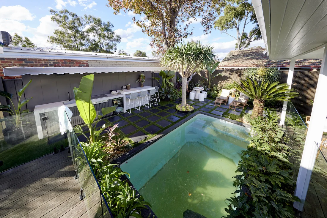 Small pool with greenery surrounding