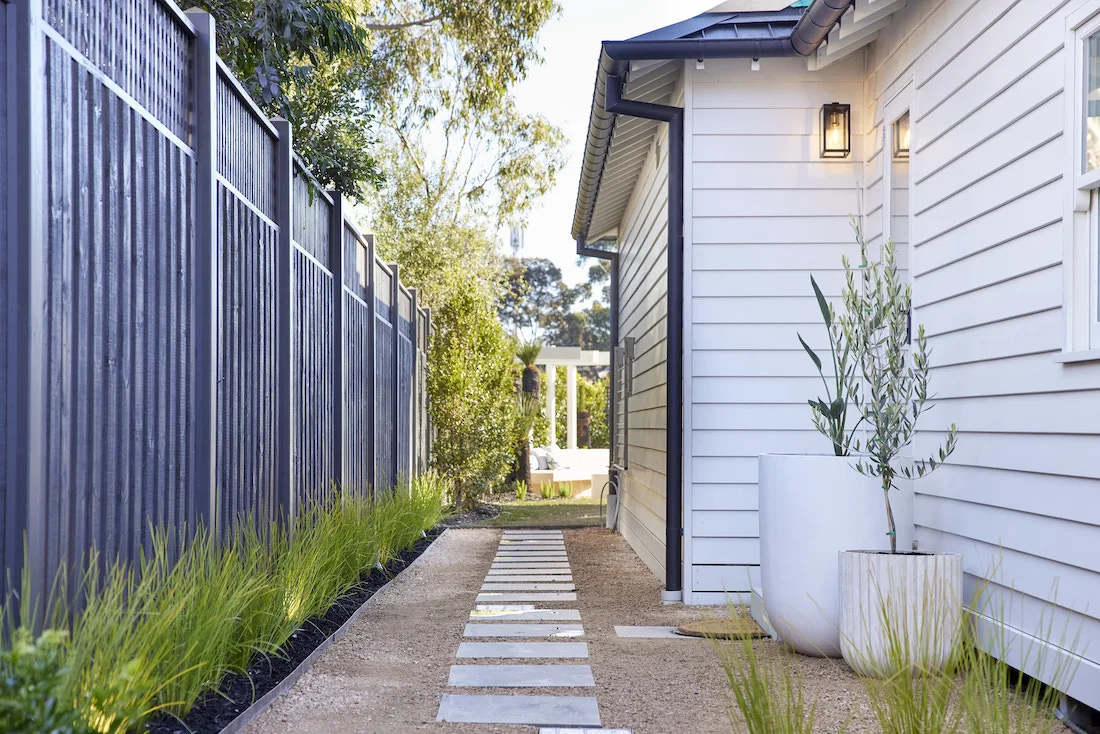 Side of home with stepping stone pavers