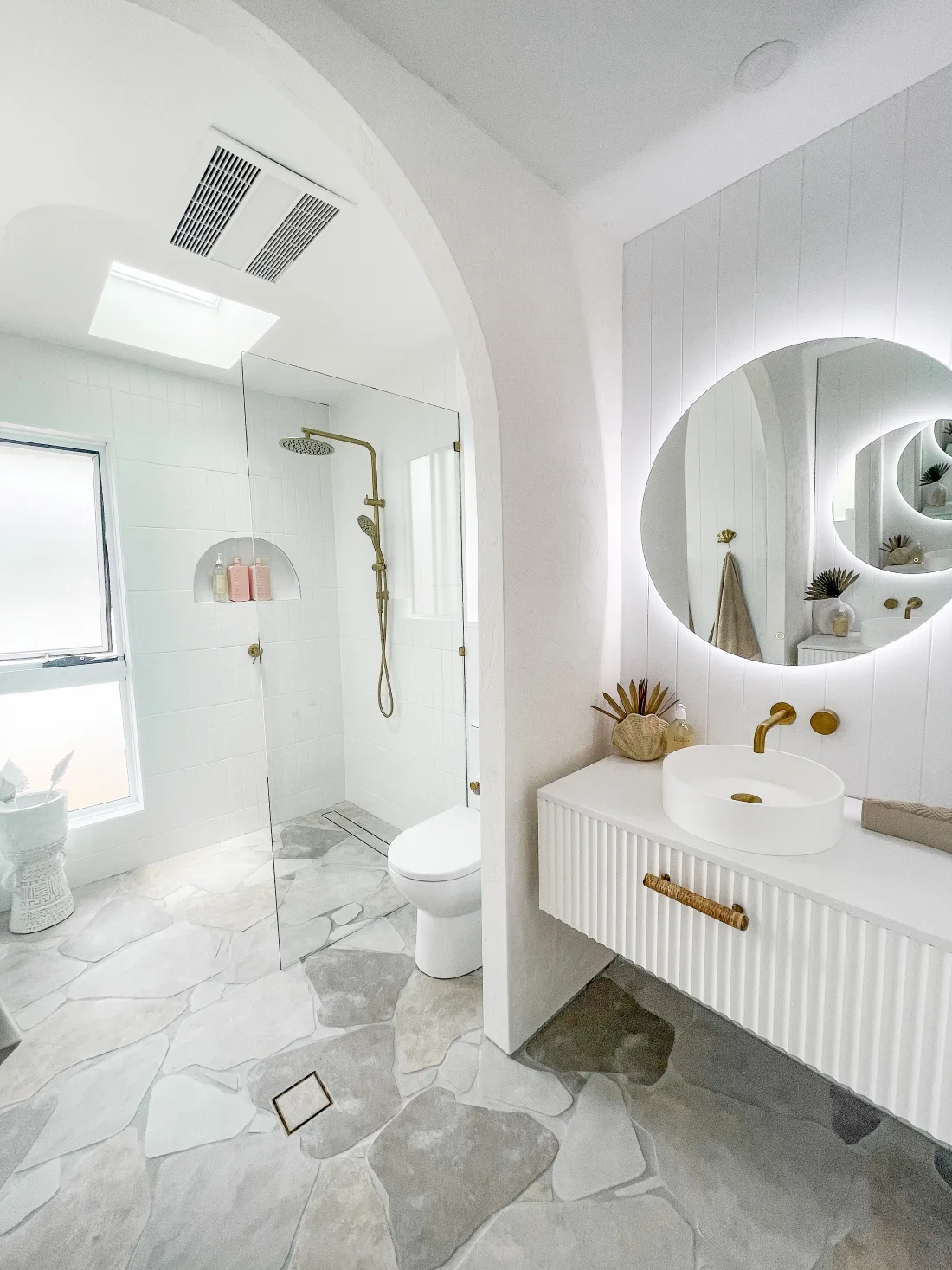 White coastal ensuite with white vanity and white sink