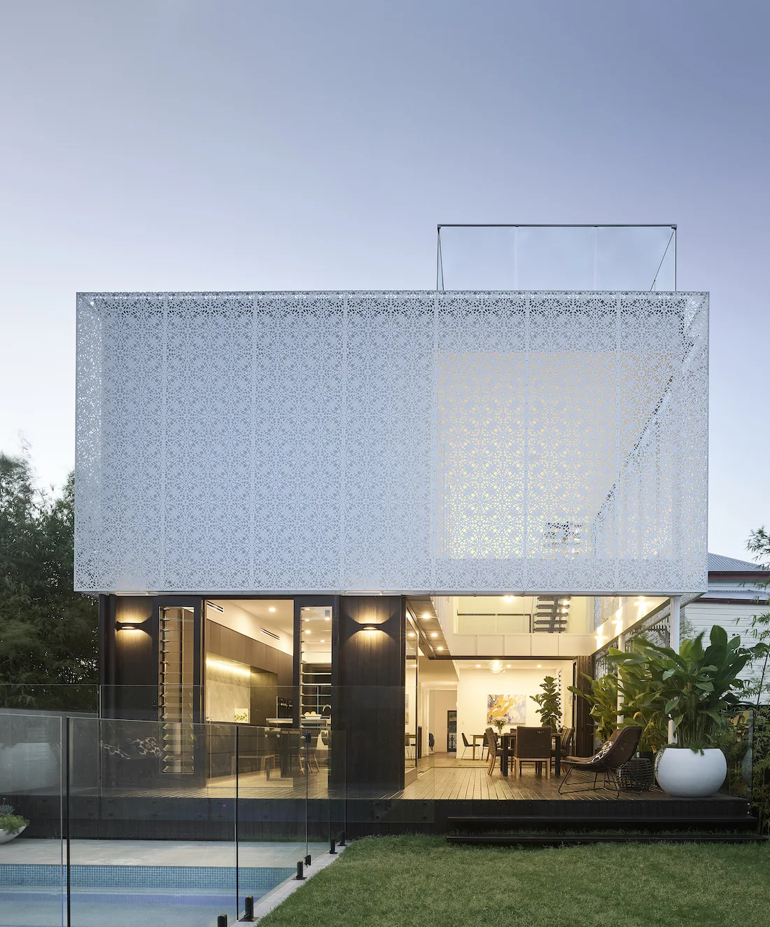 Exterior of White Lace home by night