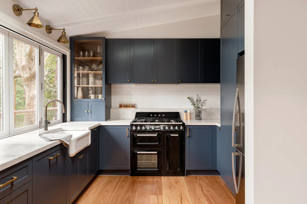 Wall sconces above kitchen sink