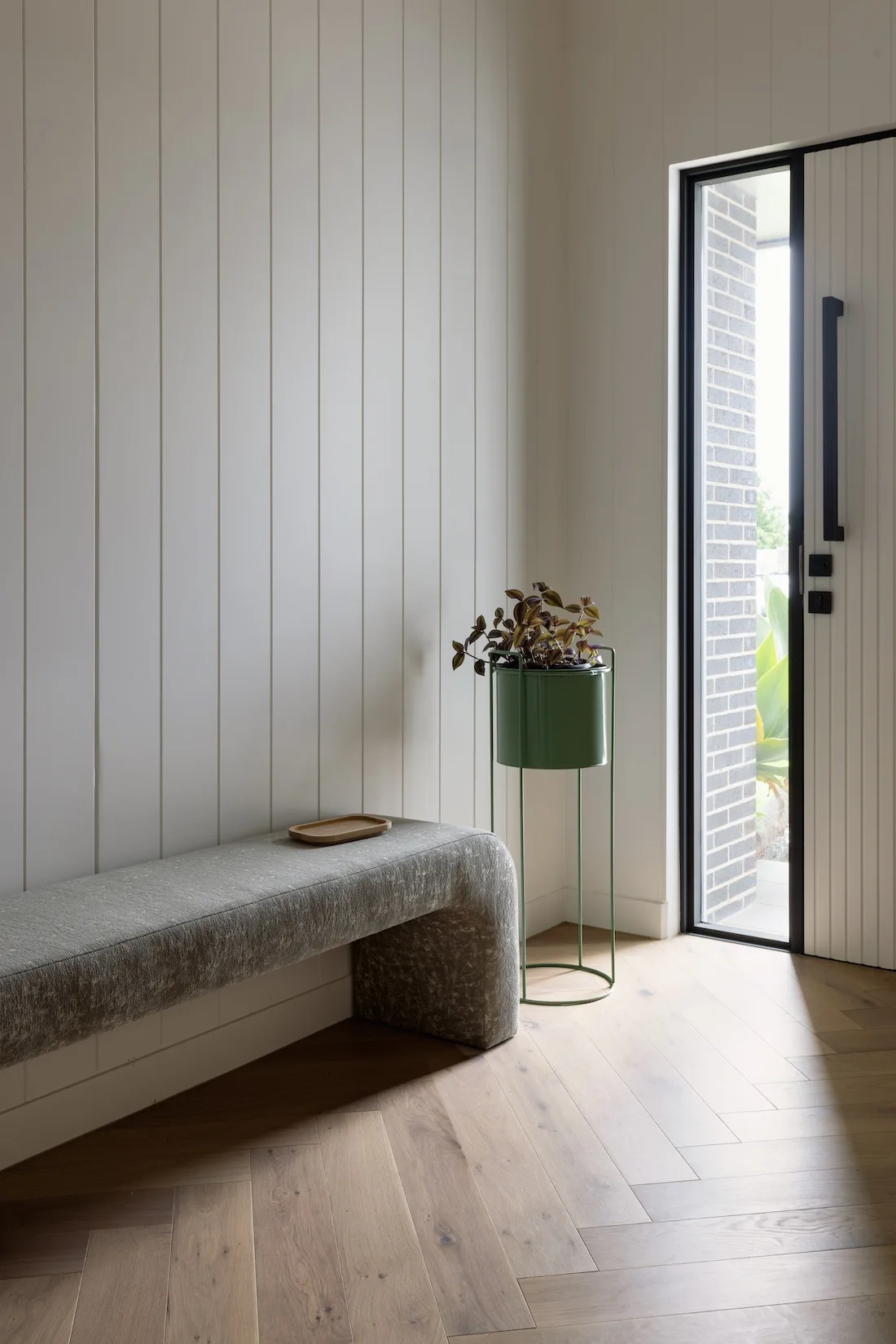 Entryway with shiplap walls and bench seat