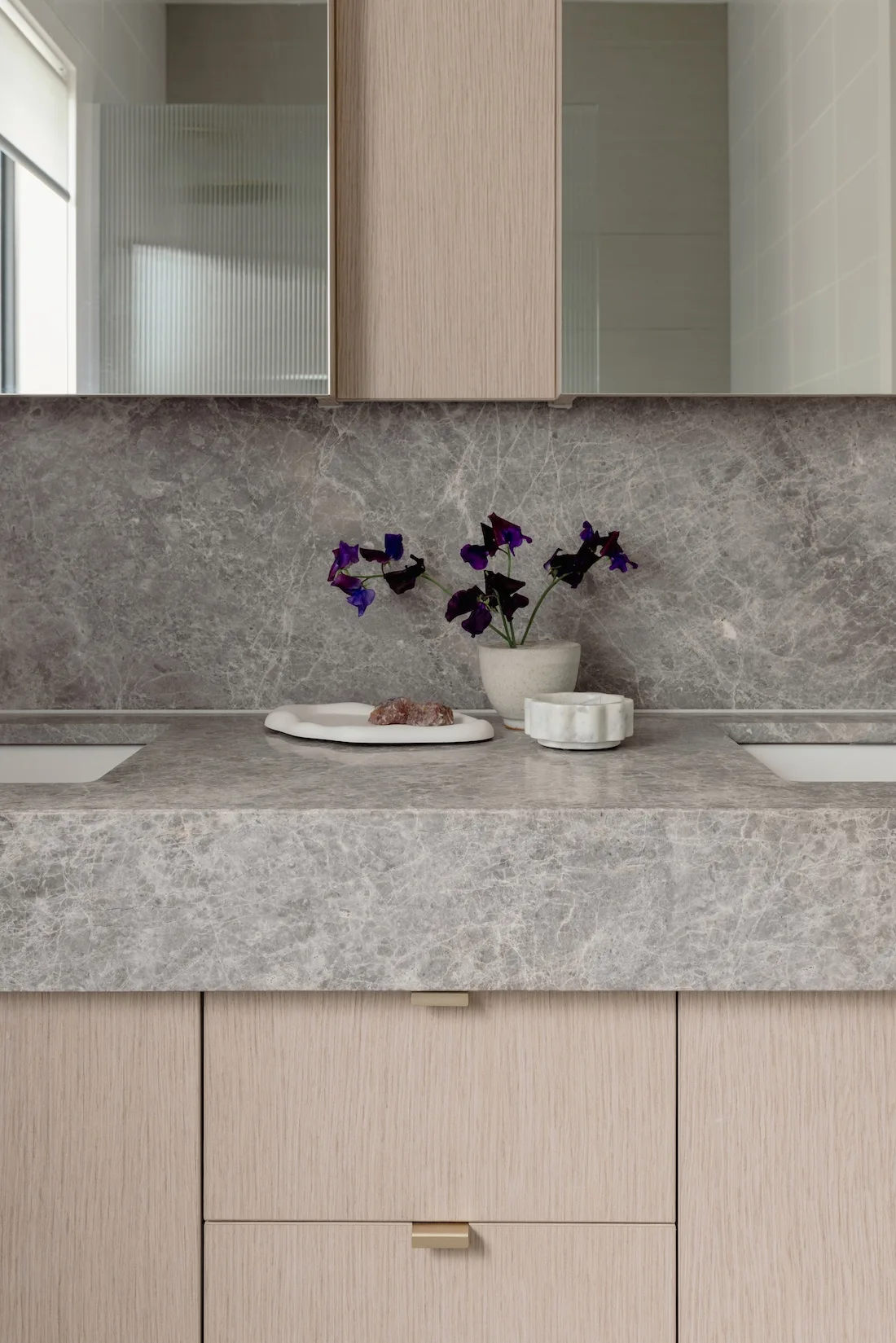 Bathroom with stone benchtops in bathroom makeover