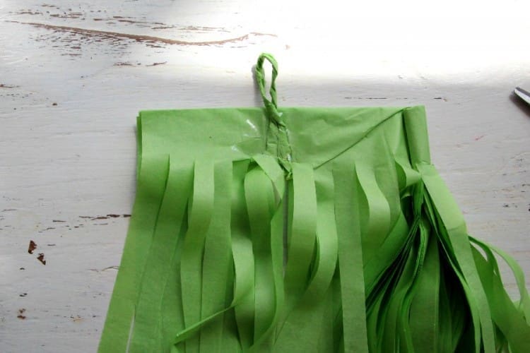 Secure the loop in place with sticky tape