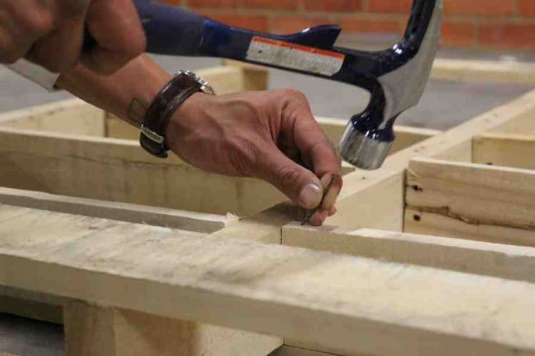 Nail planks into place