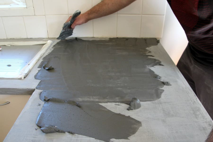 Keep layering the concrete mixture DIY concrete countertop