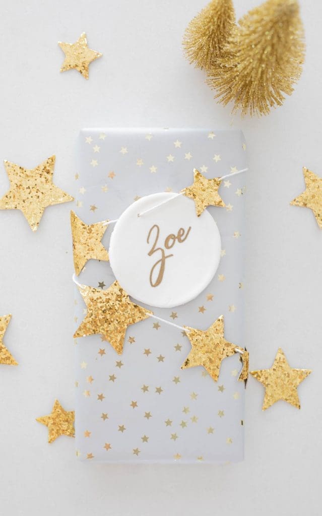 Gold star gift wrapping with DIY Christmas clay ornament