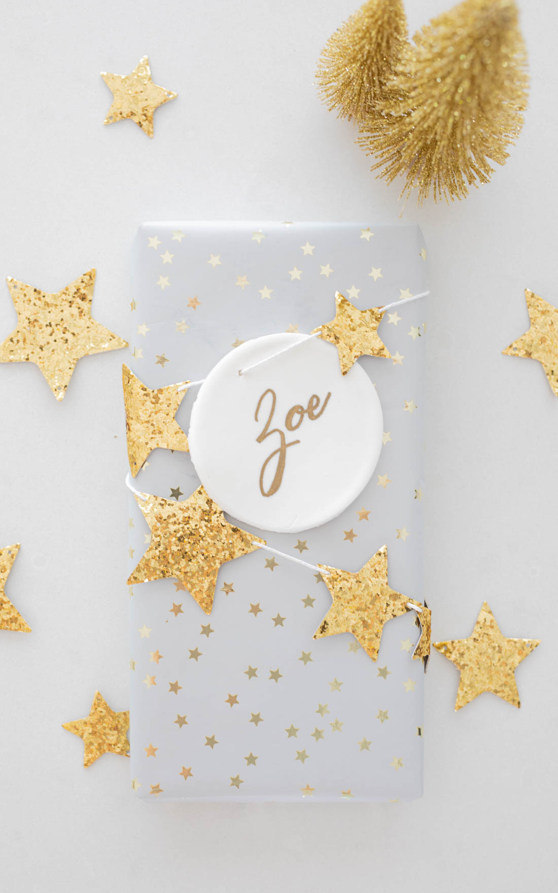 Gold star gift wrapping with DIY Christmas clay ornament