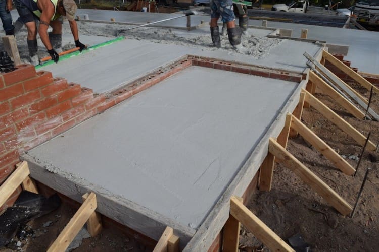 Laying the concrete slab Pouring the concrete slab