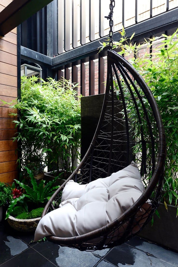 Hanging chair and water feature Outdoor terrace reveals