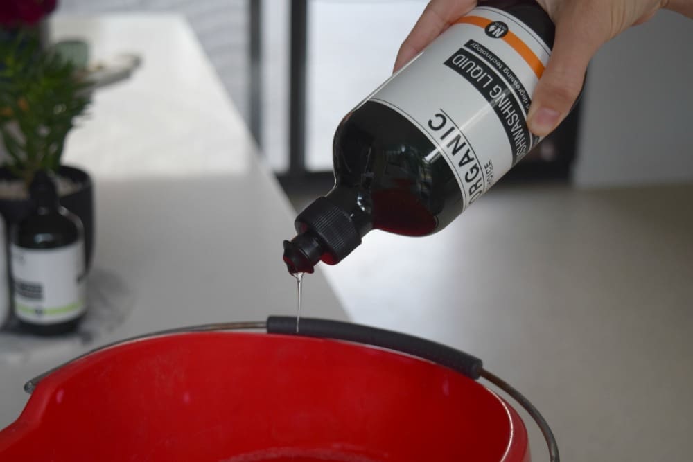 Dishwashing liquid in mop bucket is a cleaning hack from our cleaning checklist