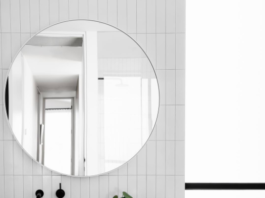 Round mirror in bathroom