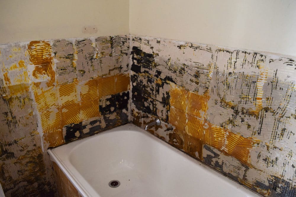 Removed old tiles around bathtub took a long time in this bathroom renovation