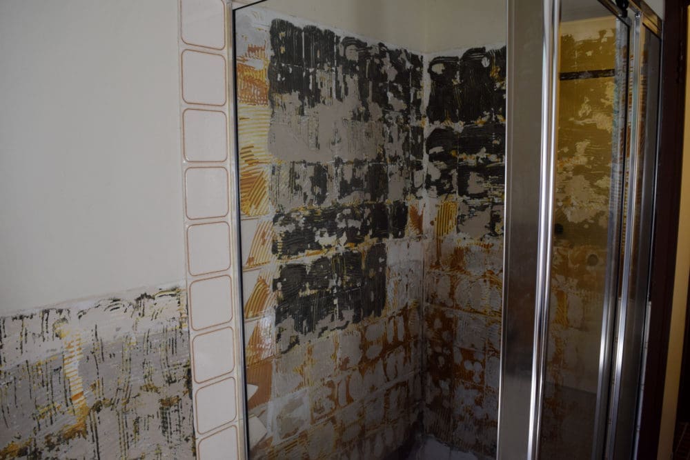 Removed shower and tiles allowed us to level the shower floor in the bathroom renovation