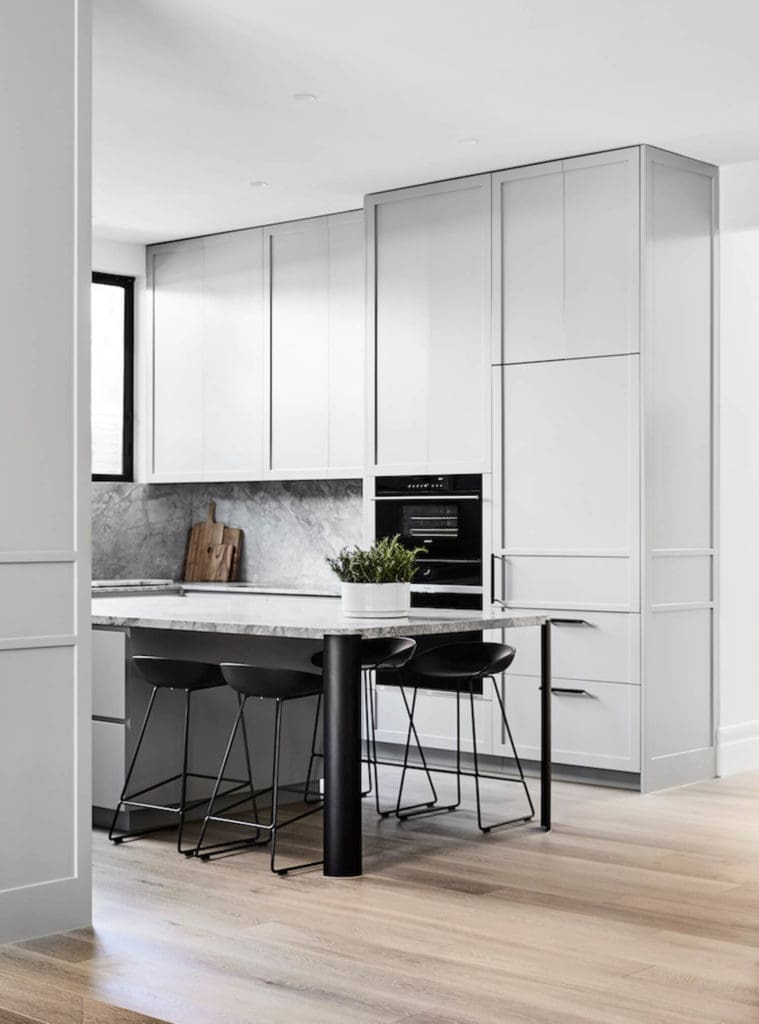 Grey kitchen with integrated bench seat dining table