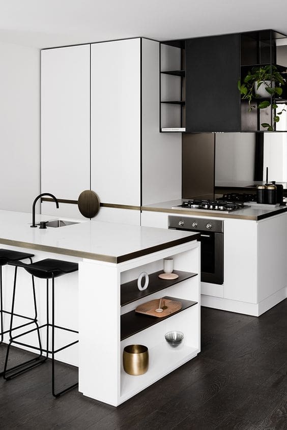 Black and white kitchen with brass edging