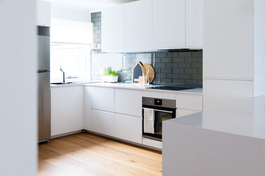 Glass and brick kitchen splashback