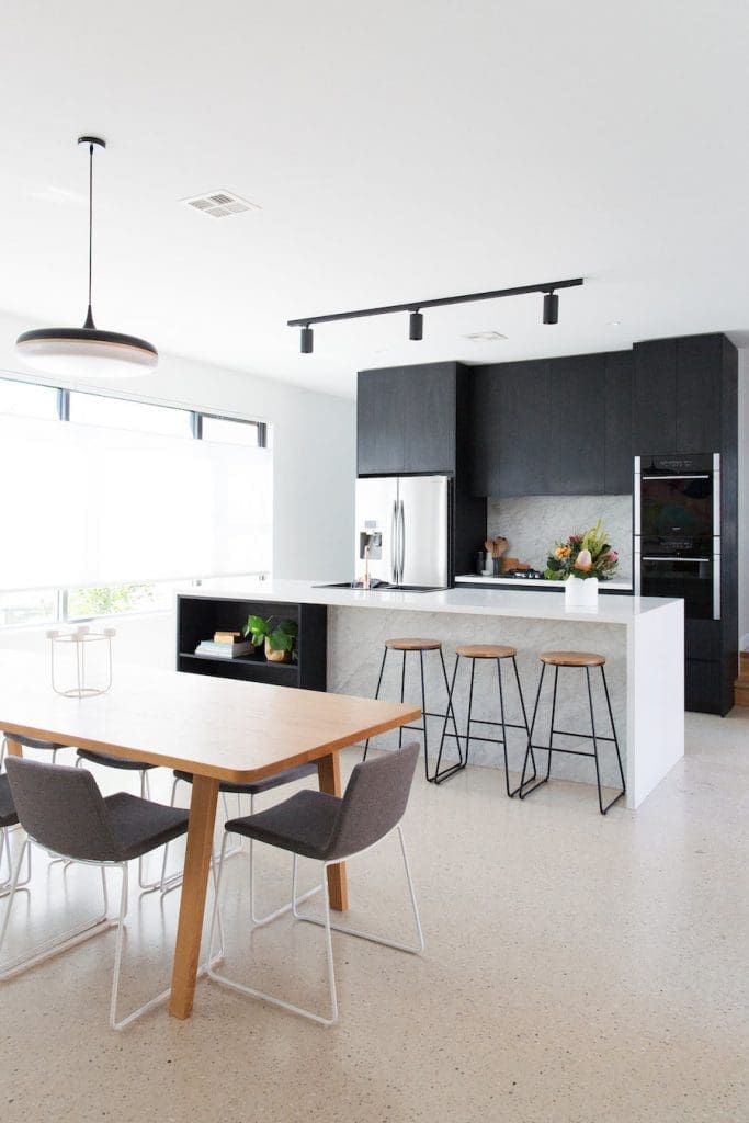 Black track light in kitchen dining portrait