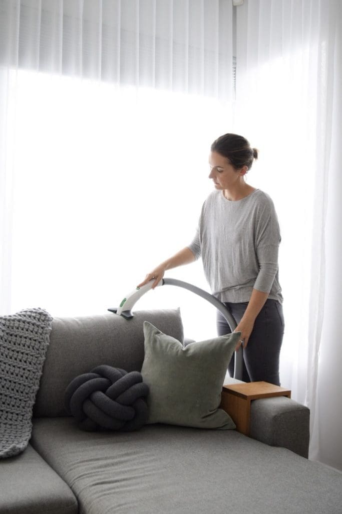 Vacuuming sofa