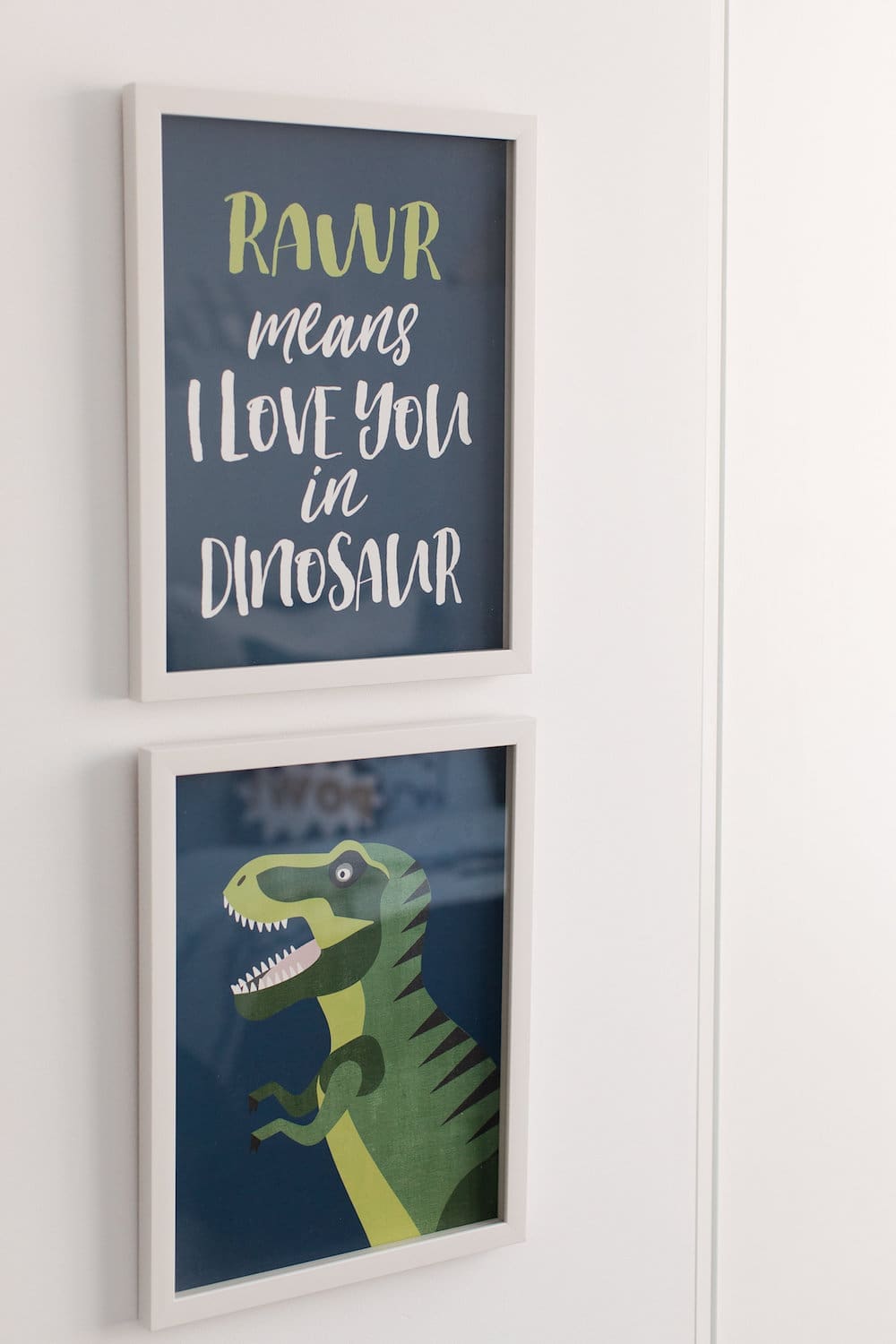 Dinosaur artwork in dinosaur theme boy room