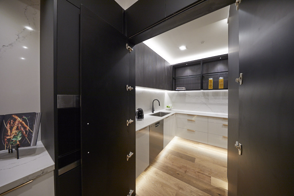 Butler's pantry hidden behind kitchen cabinets