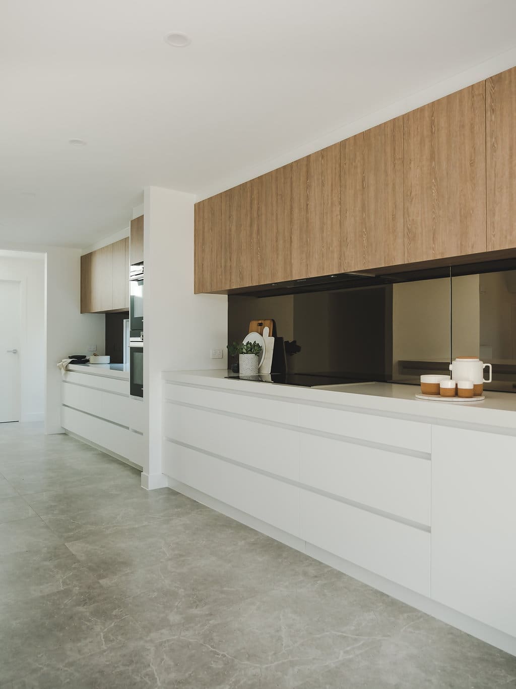 Oversized kitchen with tempered mirror splashbacks