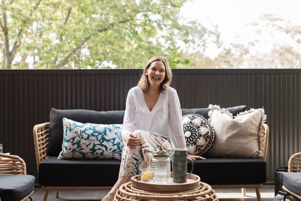 Gina in outdoor living room celebrating 5 years of Style Curator