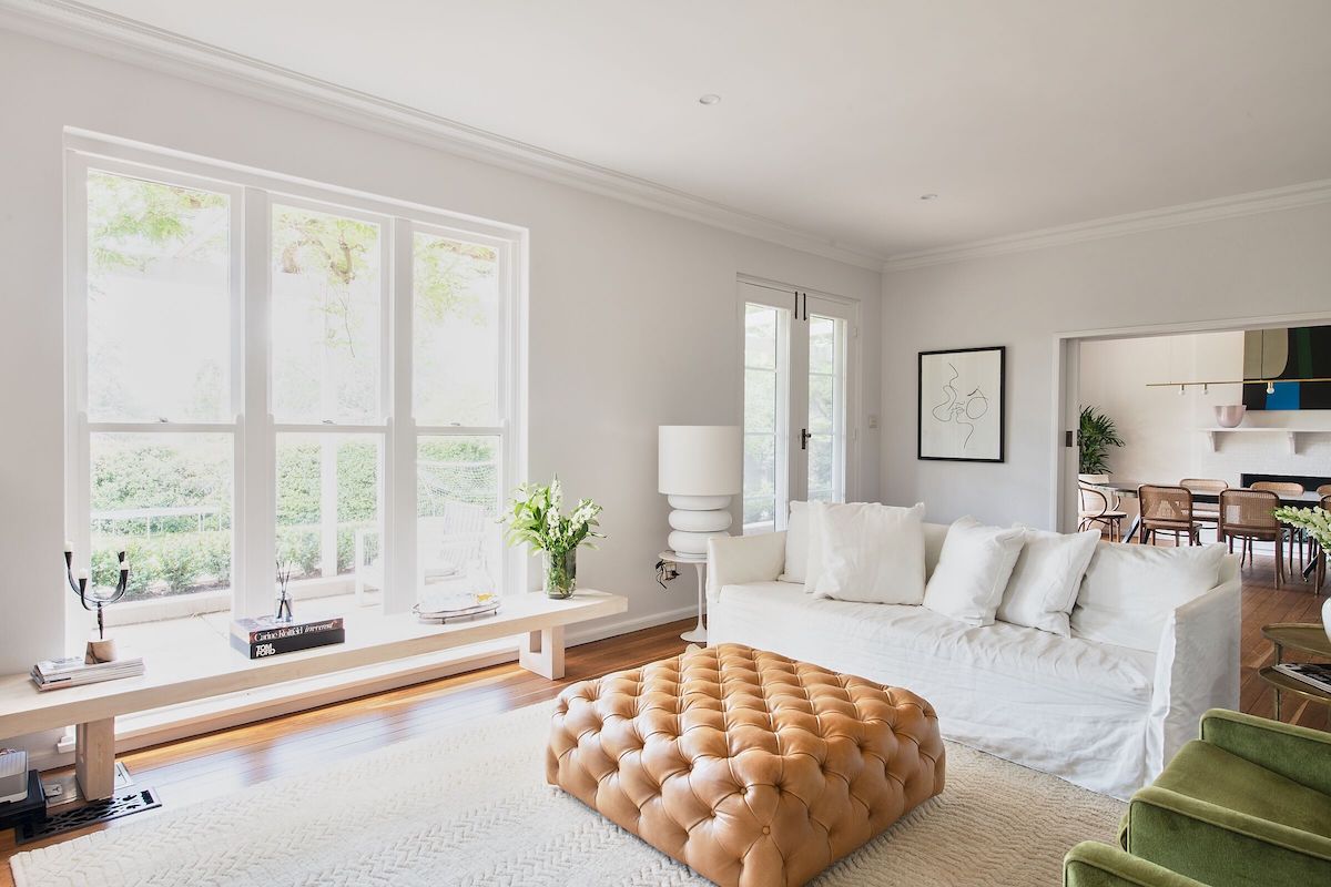 Living room out to garden in historic Wisteria House