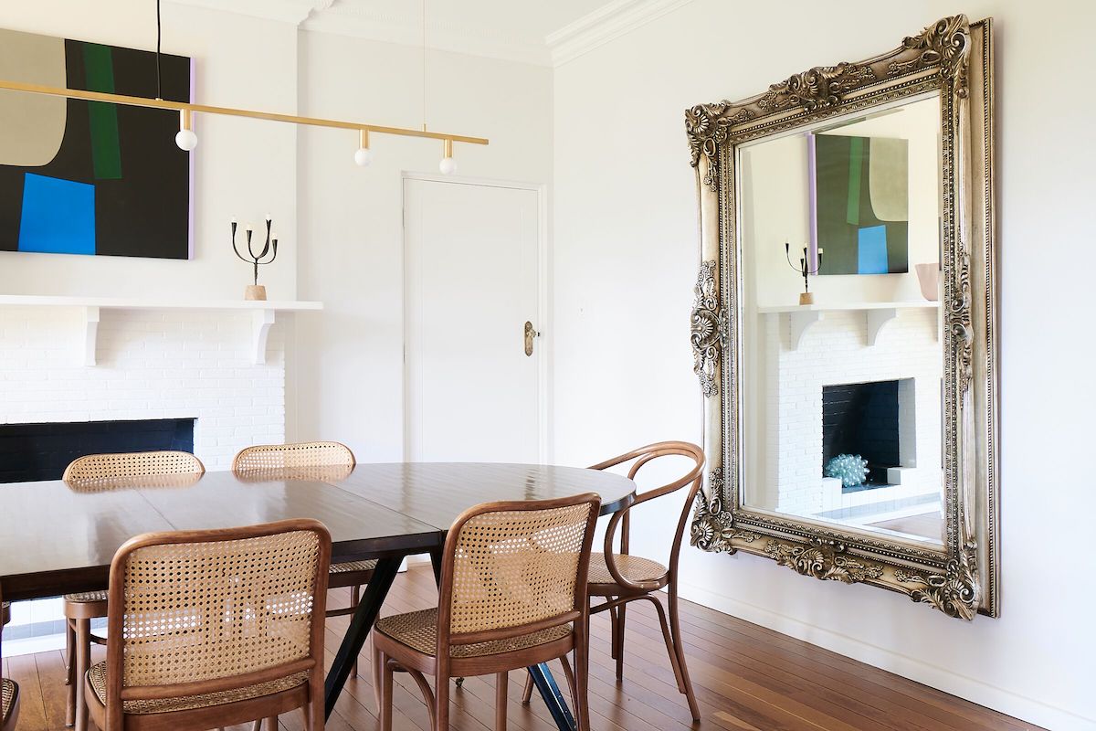 Oversized mirror in dining room