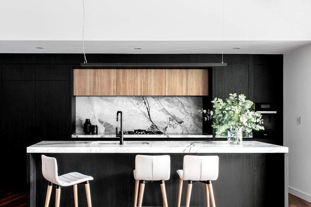Black, timber and marble kitchen