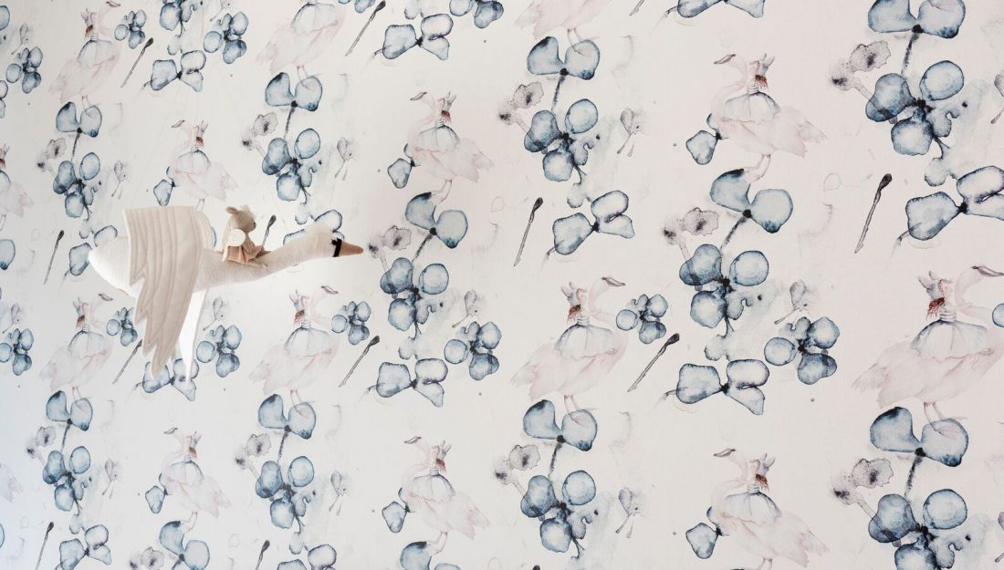 Floral wallpaper in pink and blue girl's room