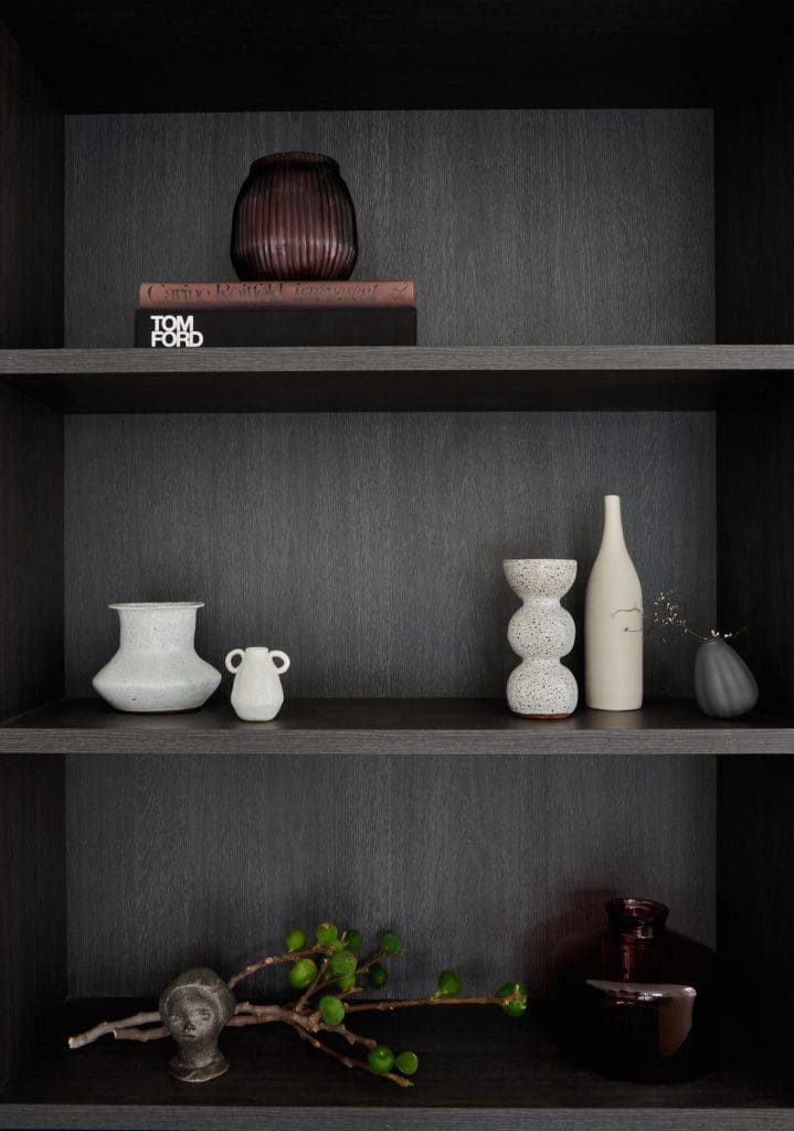Dark veneer bookcase with ceramic styling