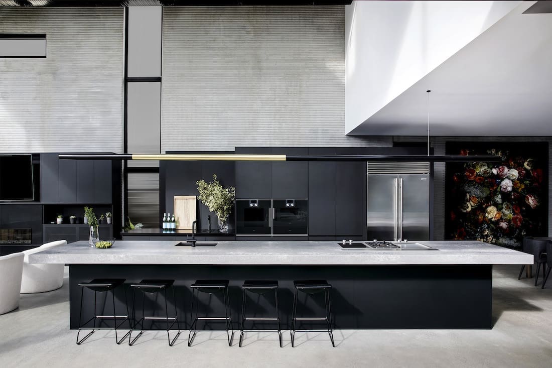 Black and grey kitchen with extra long bench