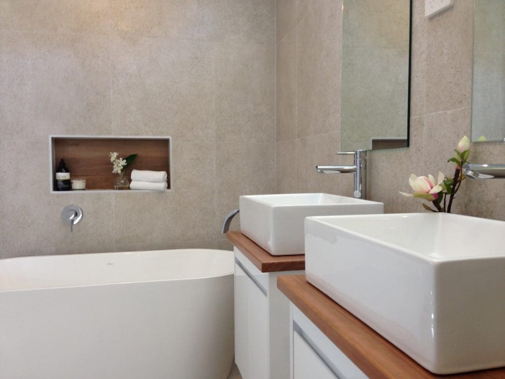 Double vanity bathroom with freestanding bath