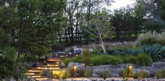 Tiered garden with wooden pontoon and lighting