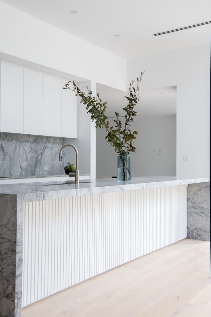 White and stone kitchen in this modern home