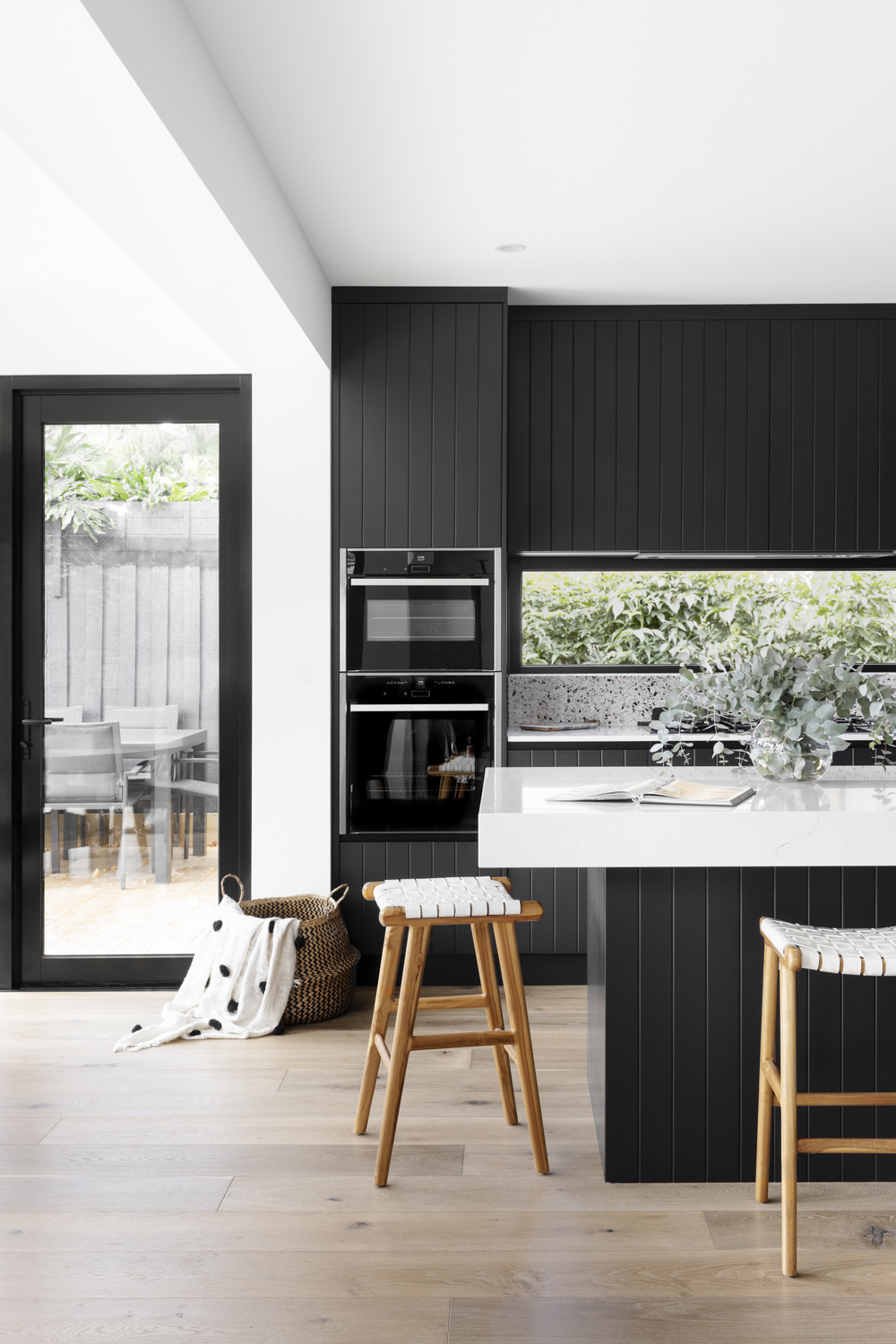 Black joinery in kitchen by GIA Bathrooms & Kitchens