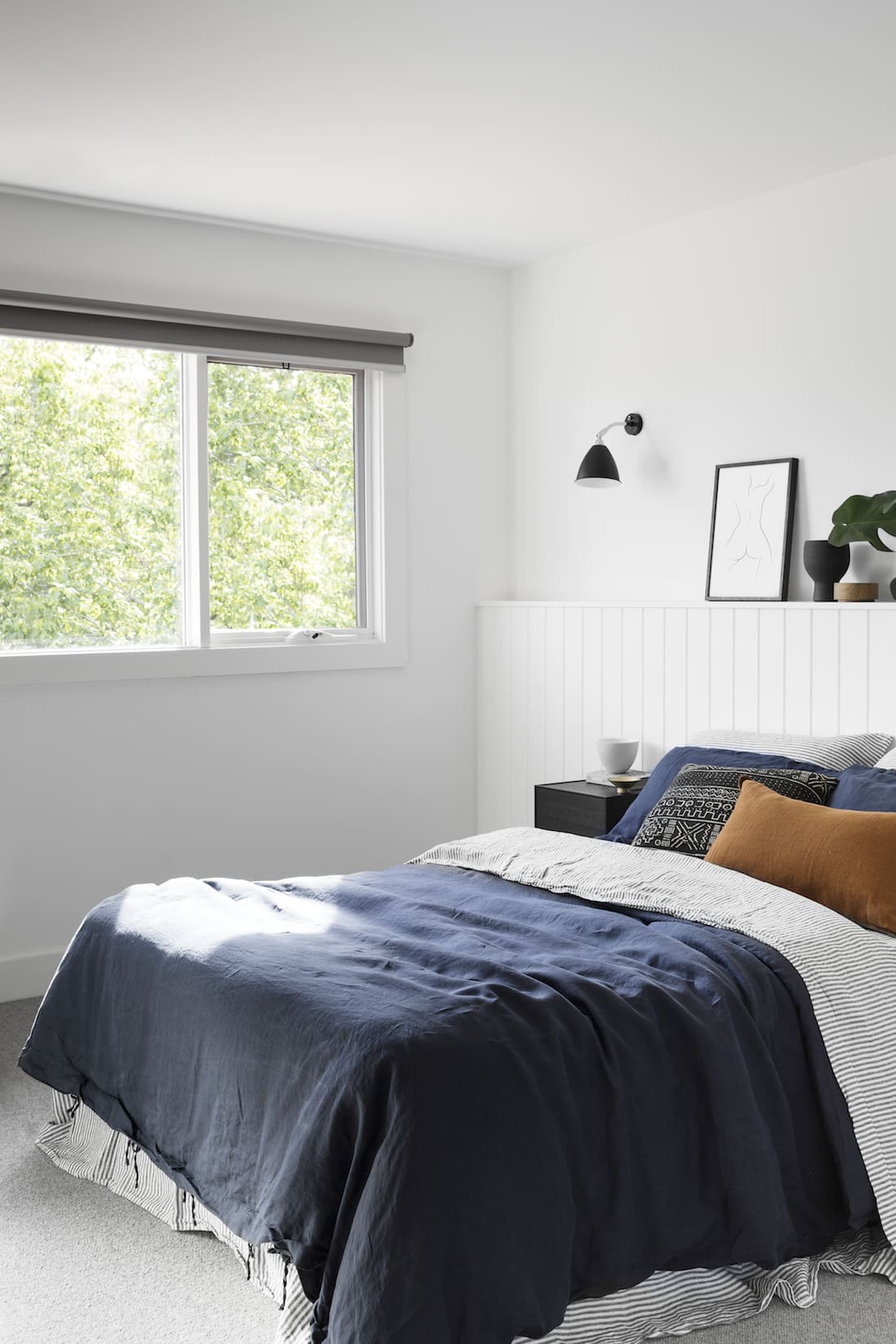 Navy and terracotta styled bedroom