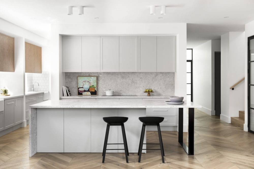 White and black kitchen with stone island
